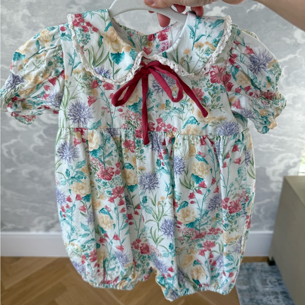 La Coqueta Floral Baby Romper with Red Bow
